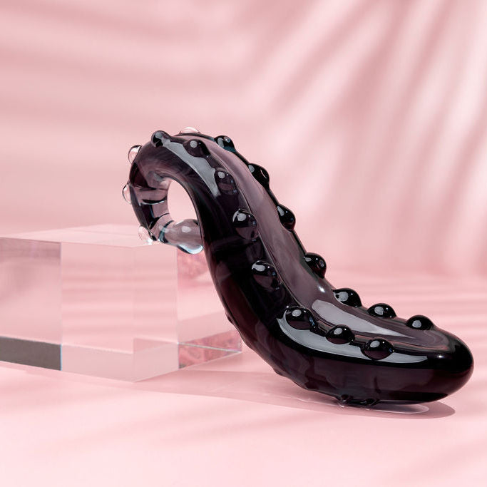 Midnight Black Ink coloured Sacred Squirter. Glass Pleasure wand with ridges pictured with acrylic block.