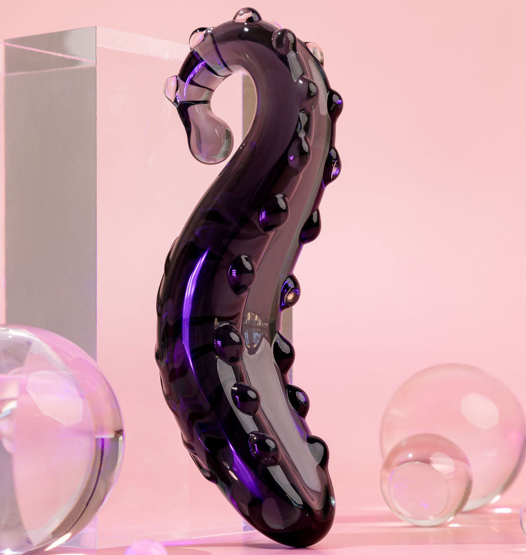 Midnight Black Ink coloured Sacred Squirter. Glass Pleasure wand with ridges pictured with acrylic block and bubbles.