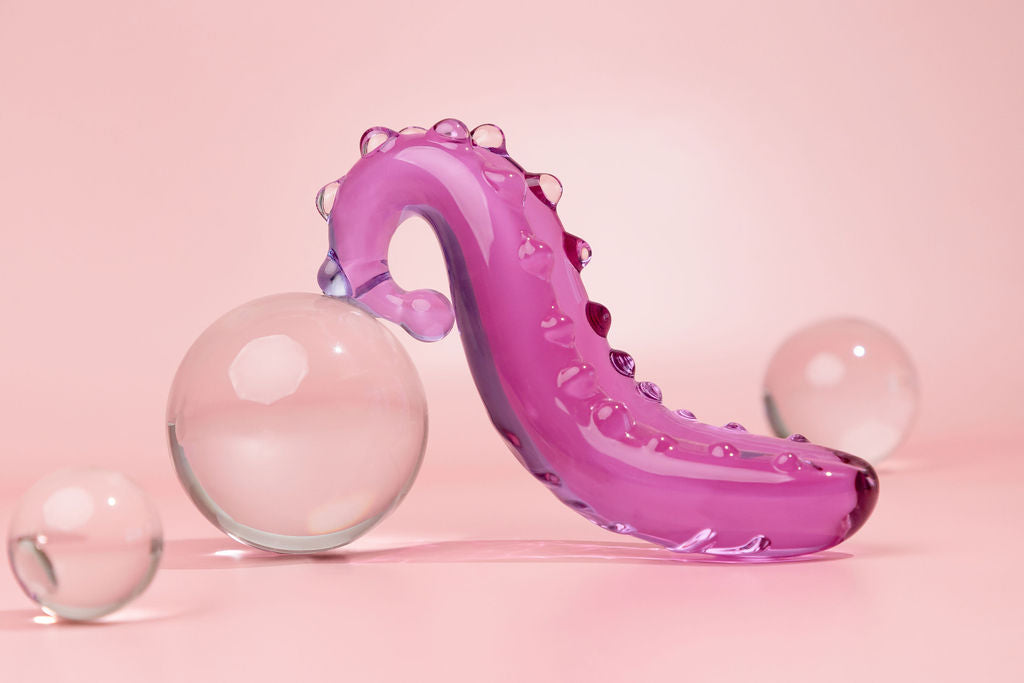 Lilac Sacred Squirter. Glass Pleasure wand with ridges pictured  with bubbles.