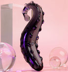 Midnight Black Ink coloured Sacred Squirter. Glass Pleasure wand with ridges pictured with acrylic block and bubbles.